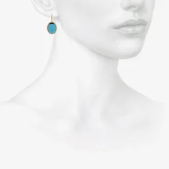18k & oval blue topaz earrings with platinum bezel