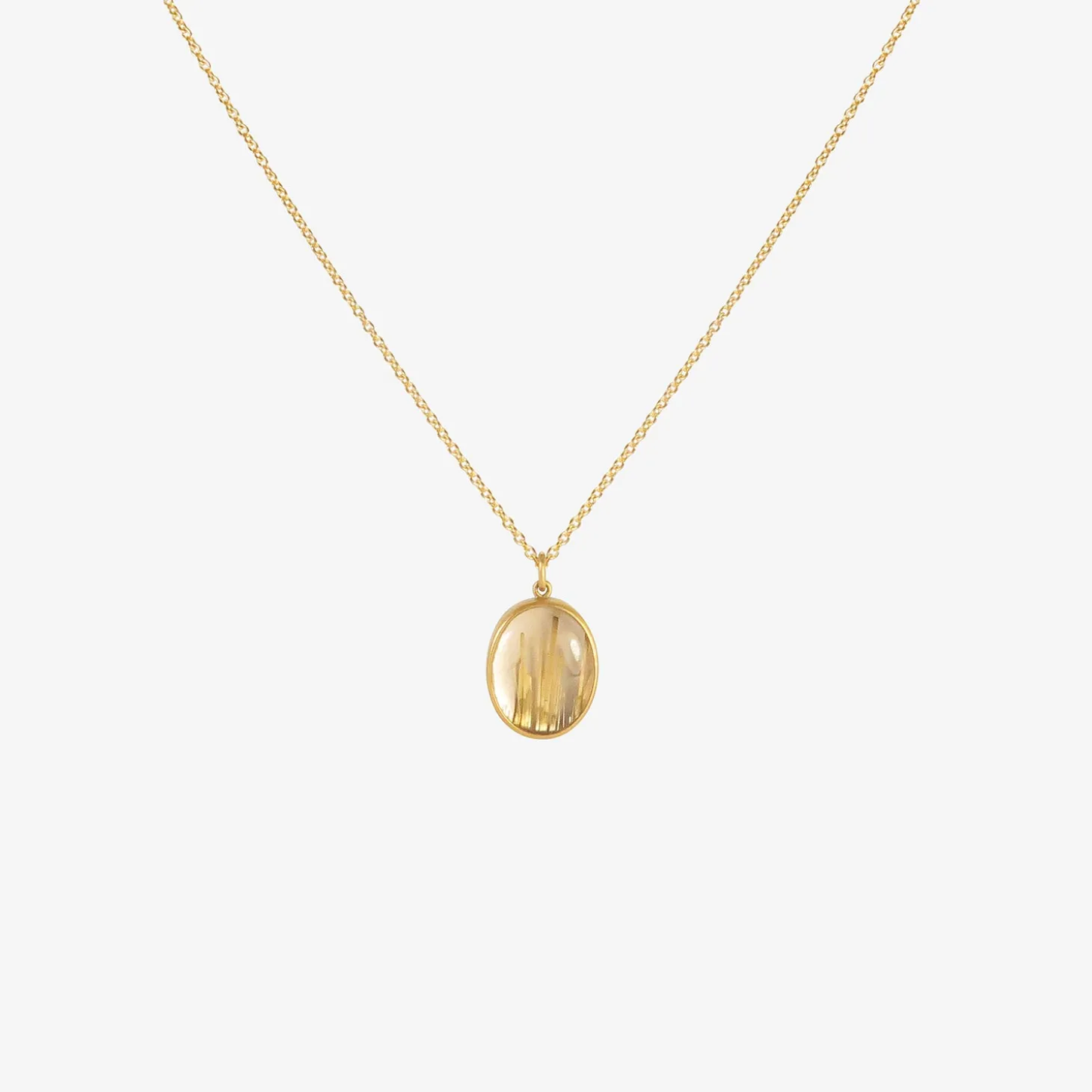 18k & small oval rutilated quartz pendant, 6.15ct