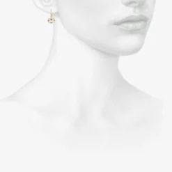 18k & small oval white topaz east / west earrings